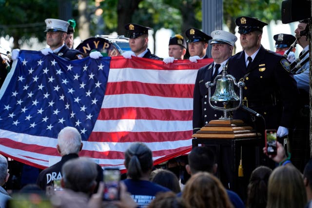 A New York Police Department ho<em></em>nour guard holds an American flag 